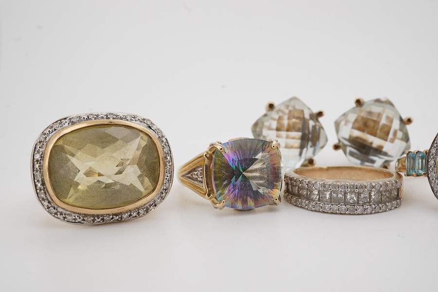 Five modern assorted 9ct gold and gem set rings, including diamond cluster half hoop and a pair of modern 9ct gold and gem set earrings, gross 38.4 grams. Condition - fair to good